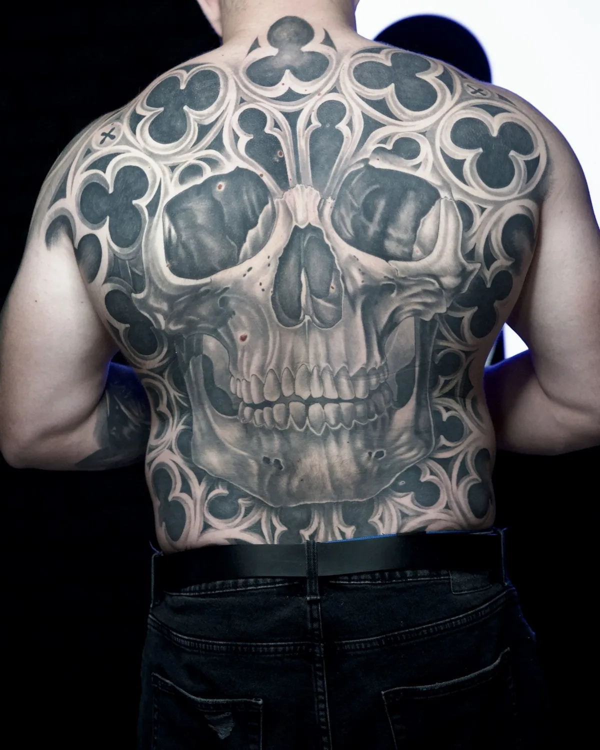 Gothic skull with stained glass across the full back, black & grey, healed